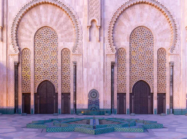 Intricate facade of Hassan II Mosque – DiscoverMoroccoNow visit Casablanca Moroccan architecture